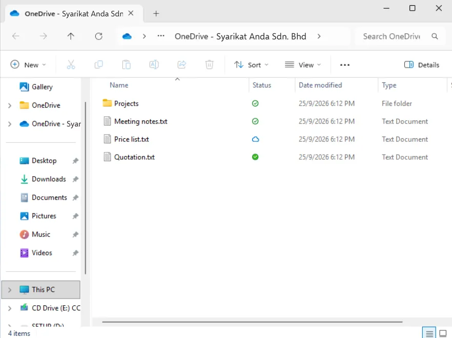 File Explorer showing the OneDrive - Syarikat Anda Sdn. Bhd folder with a blue cloud, green outline ticks and a solid green tick in the Status column